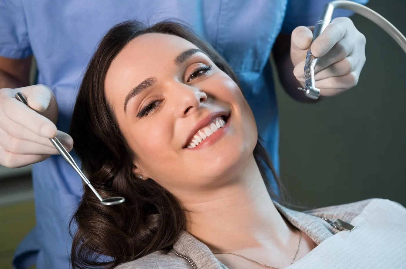 A smiling patient relaxing in the dental chair during a check-up